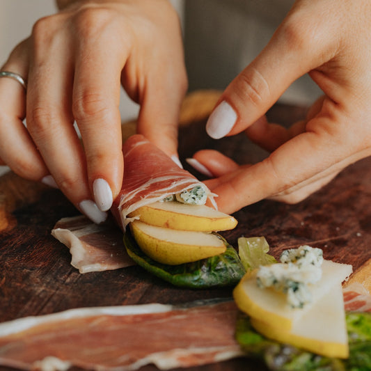Prosciutto salad wraps filled with baby lettuce blend, pear and gorgonzola cheese