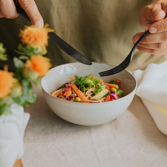 Soba noodle salad with green leaf, edamame, carrots, cabbage, red pepper, cucumber and scallions + a peanut dressing